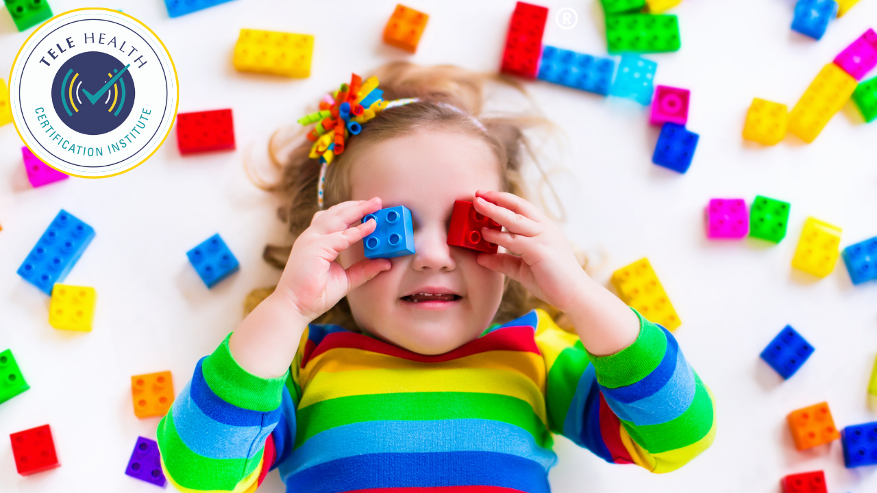 young boy playing with colored building bricks