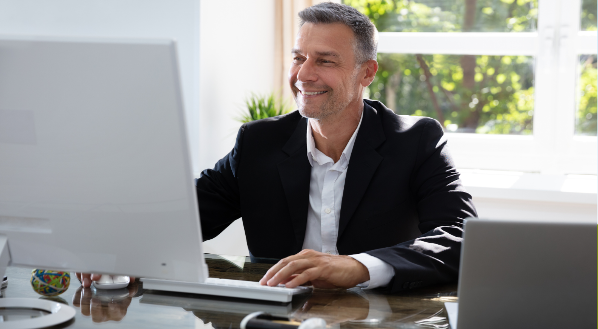 Male counselor using desk computer