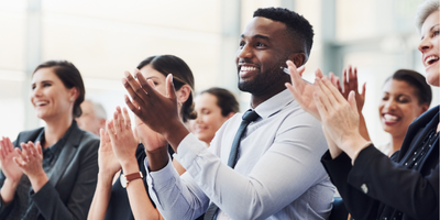 training attendees applauding instructor