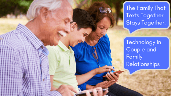 inter-generational family on bench using mobile phones