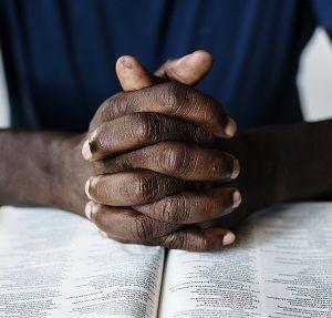 African American man military vet with hands clasped