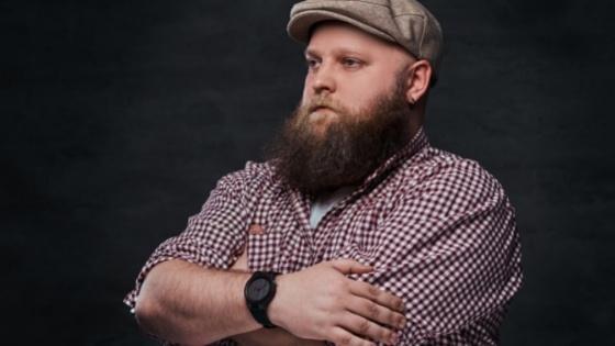 Man with folded harms Seeking Online Counseling Overcome Barriers to Access