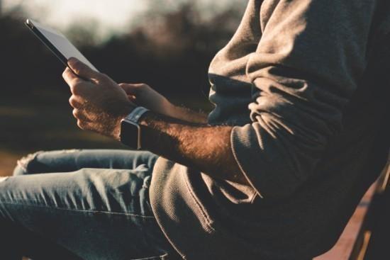 Man reading and Preparing For a Video Meeting