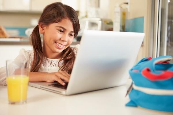 Child smiling at screen